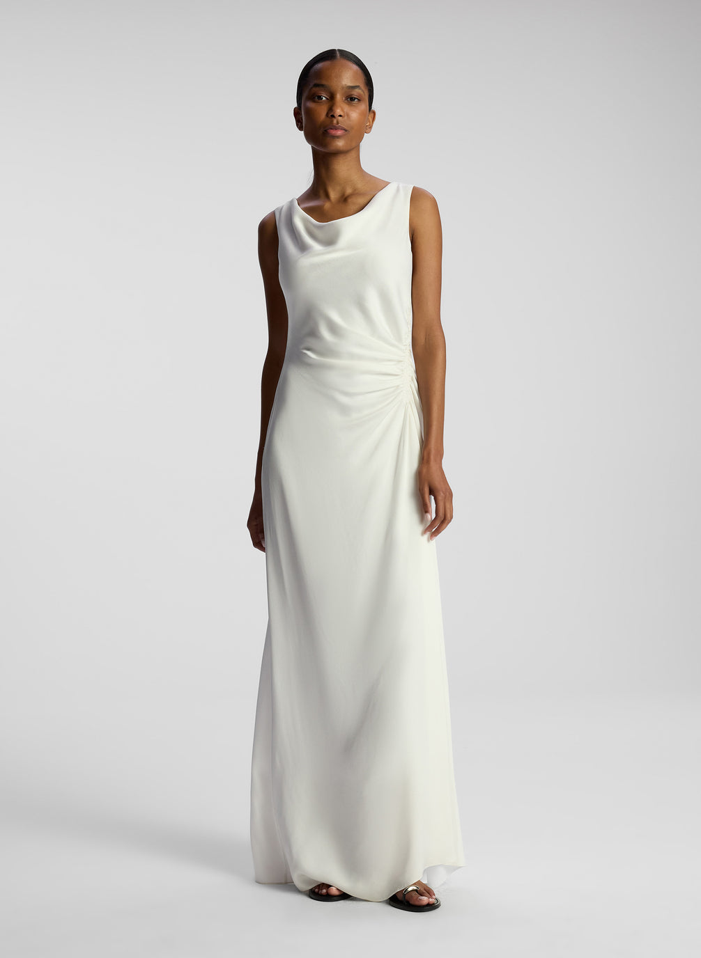 front view of woman wearing white maxi dress