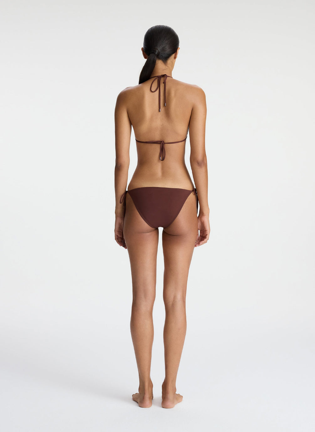back  view of woman wearing brown bikini set