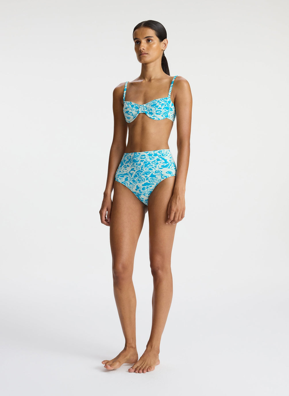side view of woman wearing aqua print bikini set