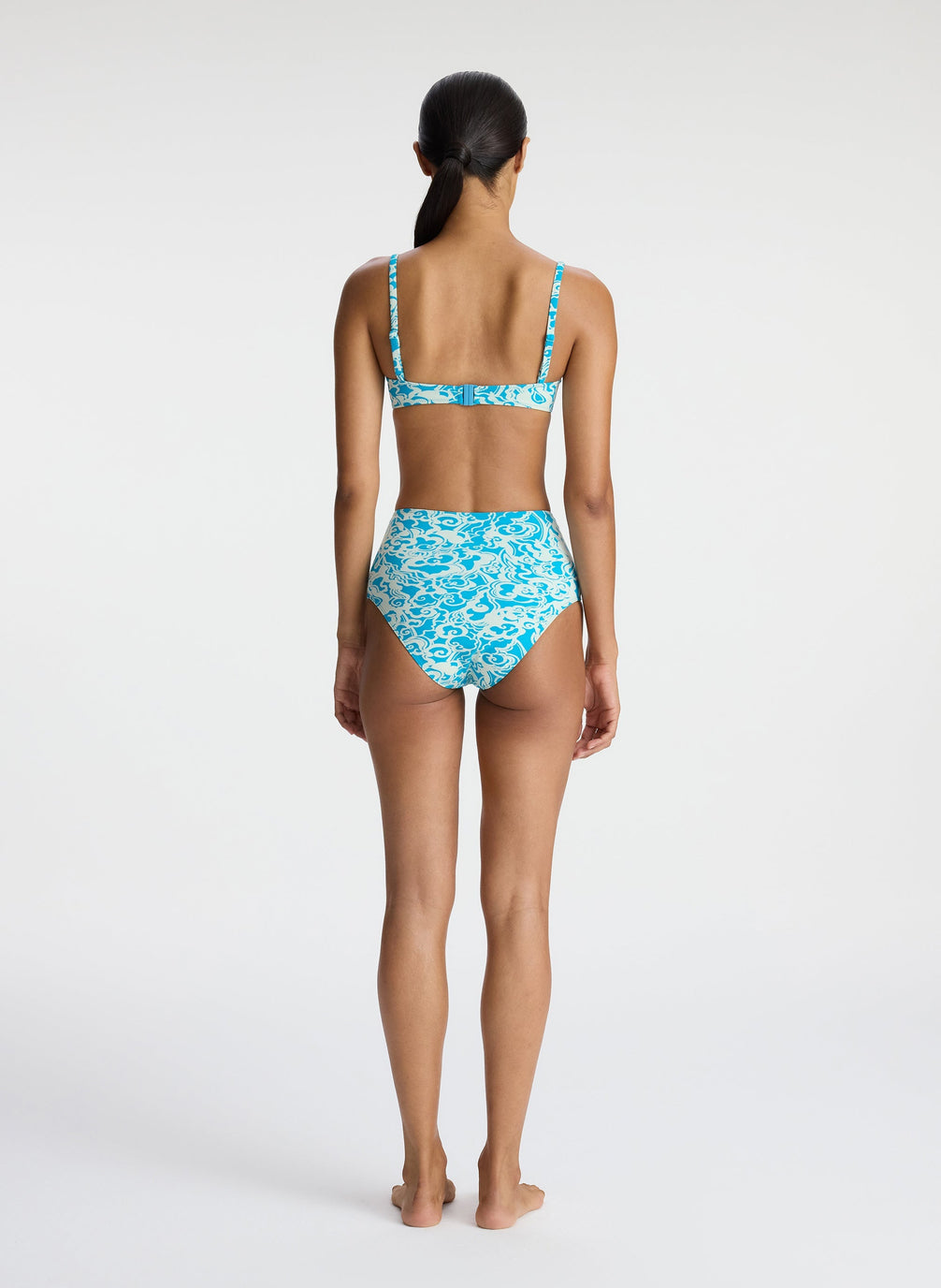 back view of woman wearing aqua print bikini set