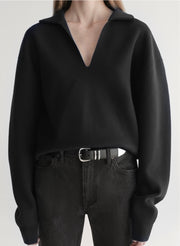 woman wearing black sweater with black denim jeans