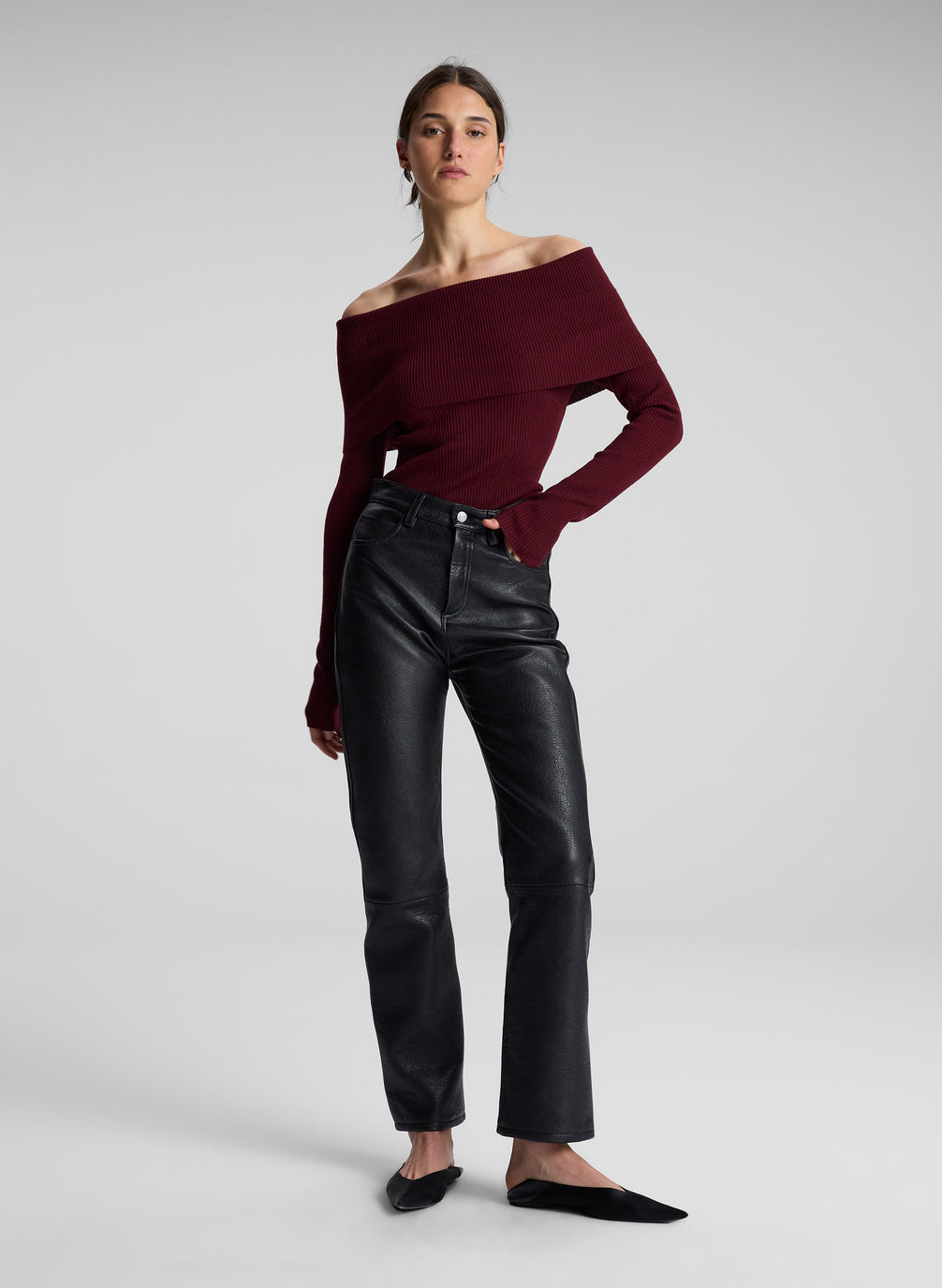 woman wearing maroon off shoulder top and black leather pants