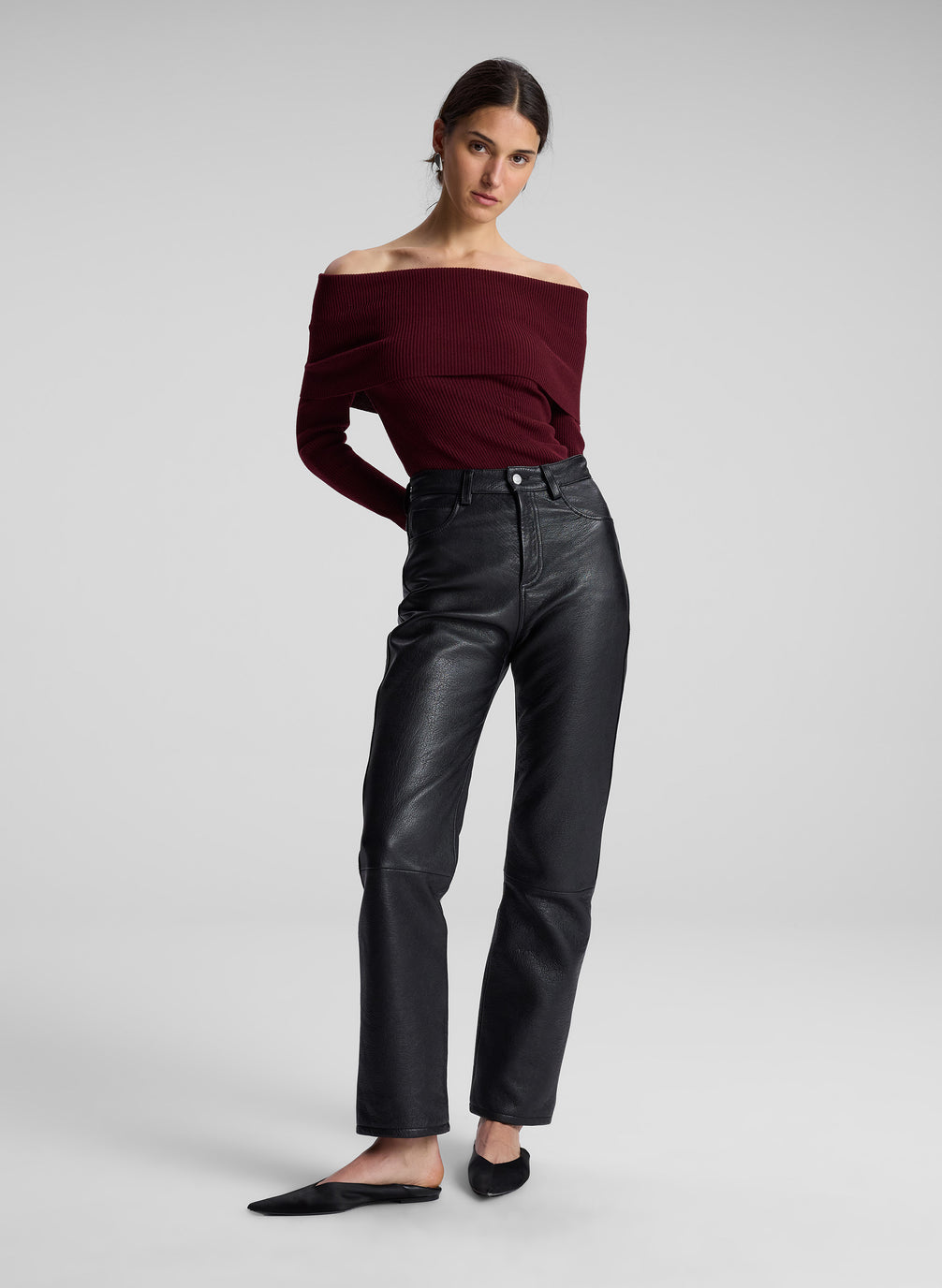 woman wearing maroon off shoulder top and black leather pants