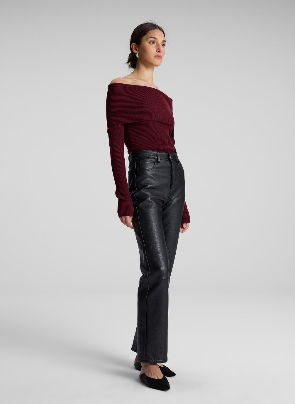 woman wearing maroon off shoulder top and black leather pants