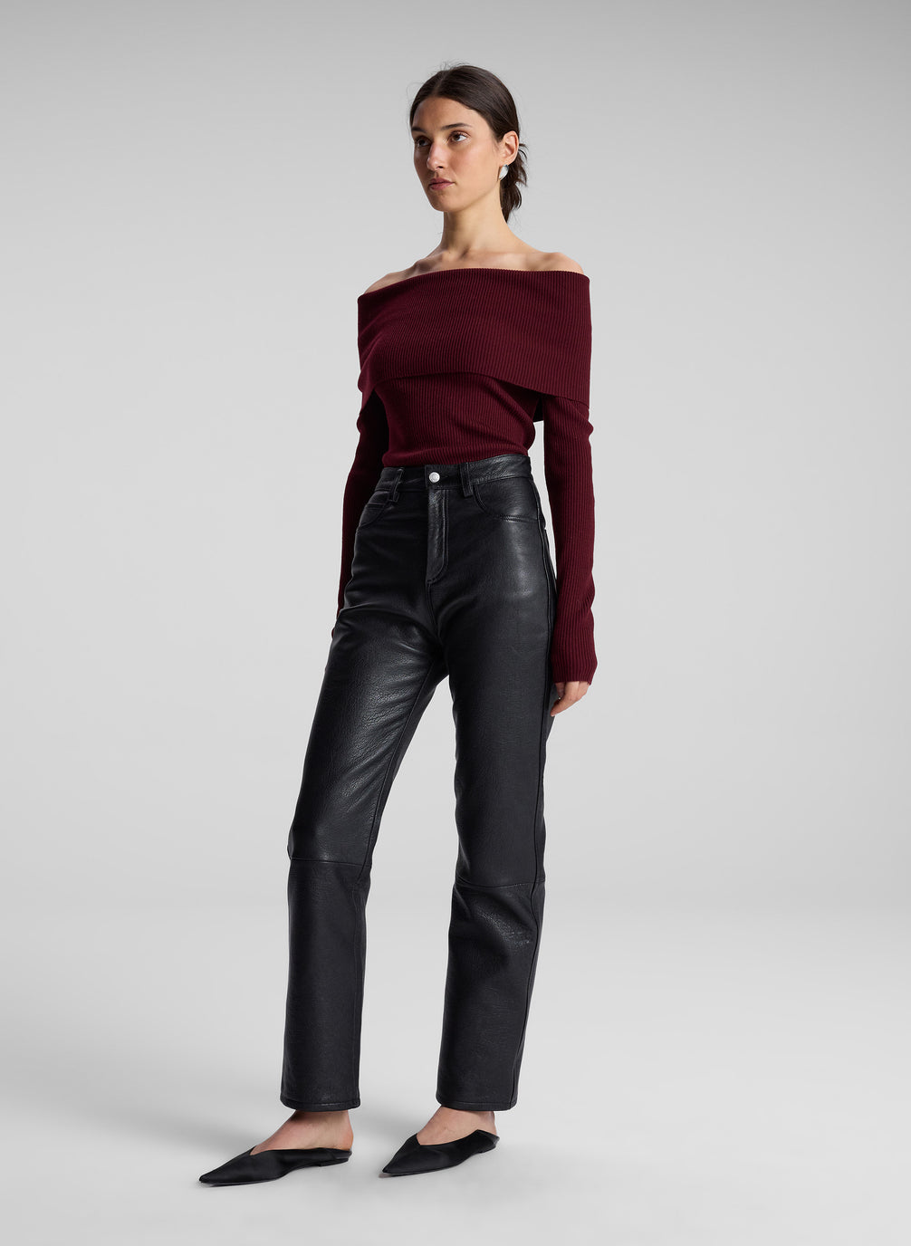 woman wearing maroon off shoulder top and black leather pants