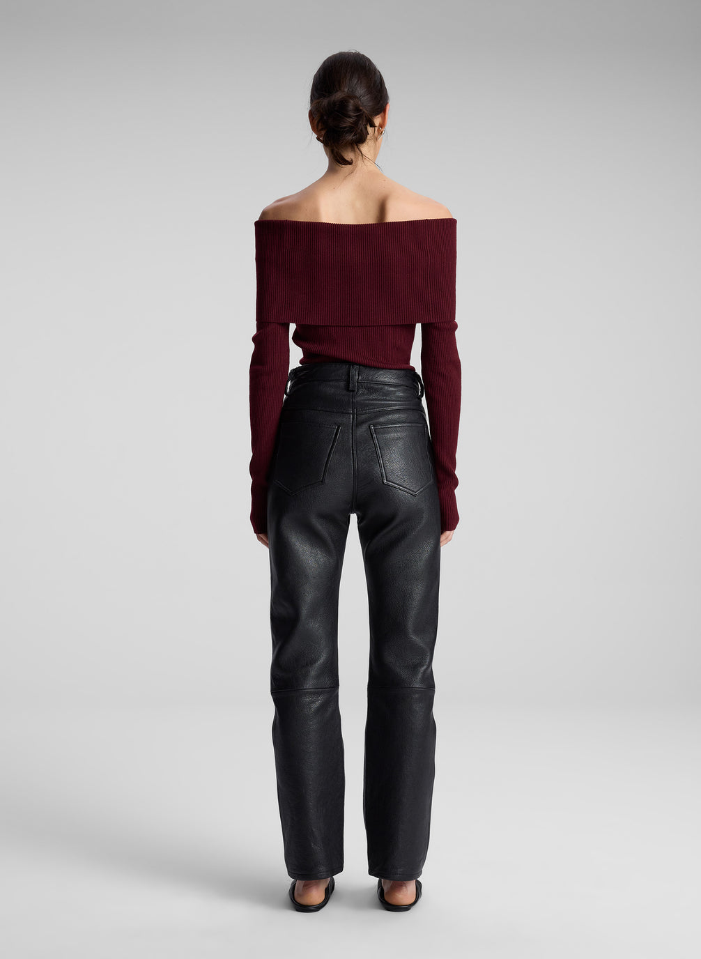 woman wearing maroon off shoulder top and black leather pants