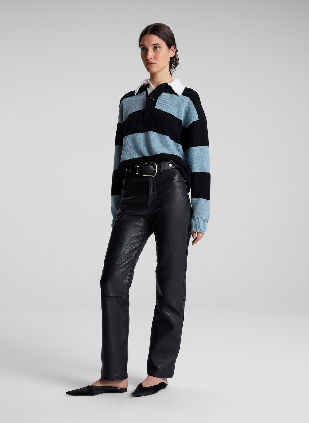 woman wearing striped collared sweater and black leather pants