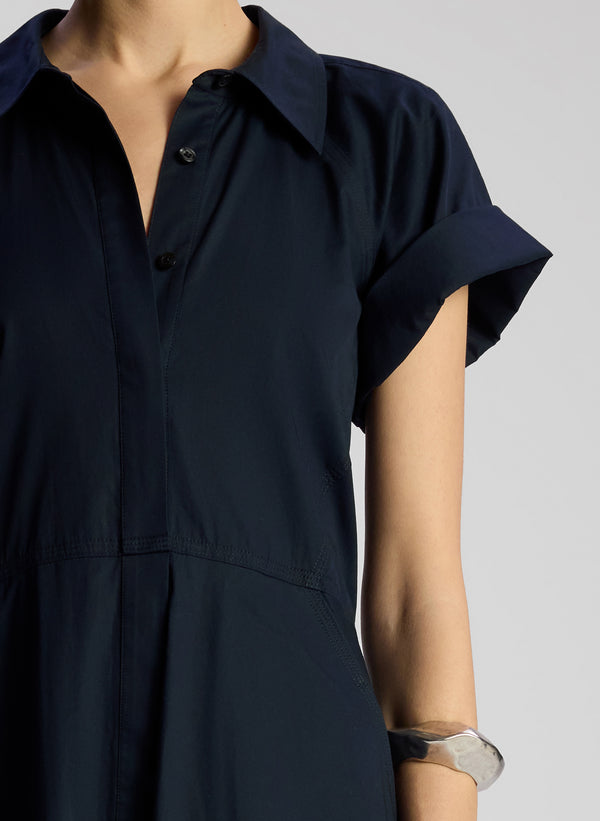 detail view of woman wearing navy blue midi shirtdress