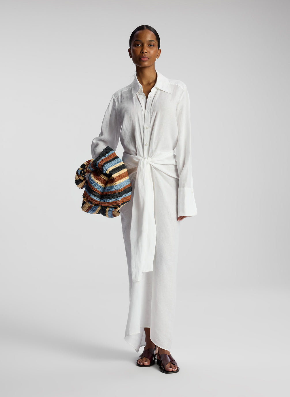 front view of woman wearing white linen maxi shirtdress