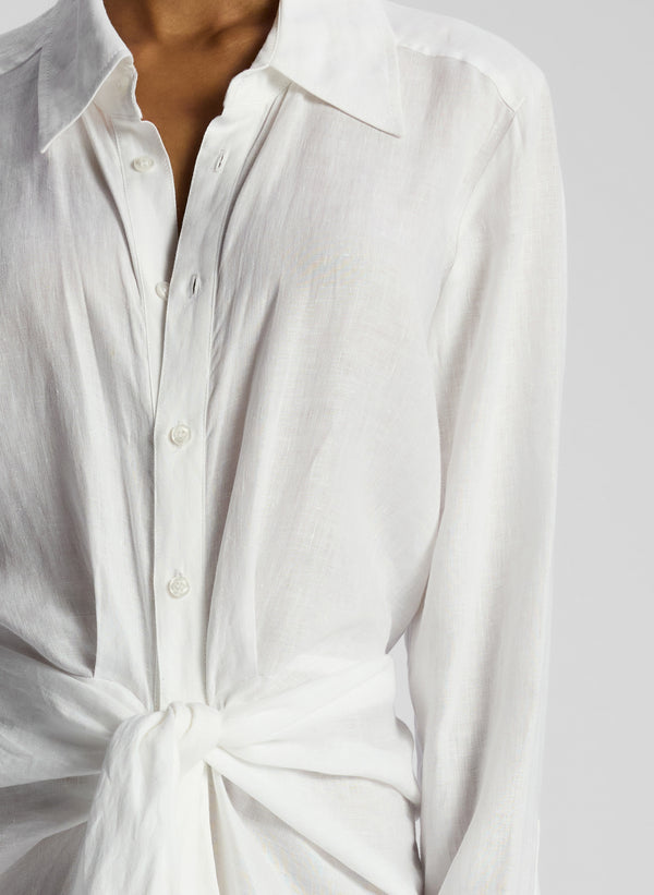 detail view of woman wearing white linen maxi shirtdress