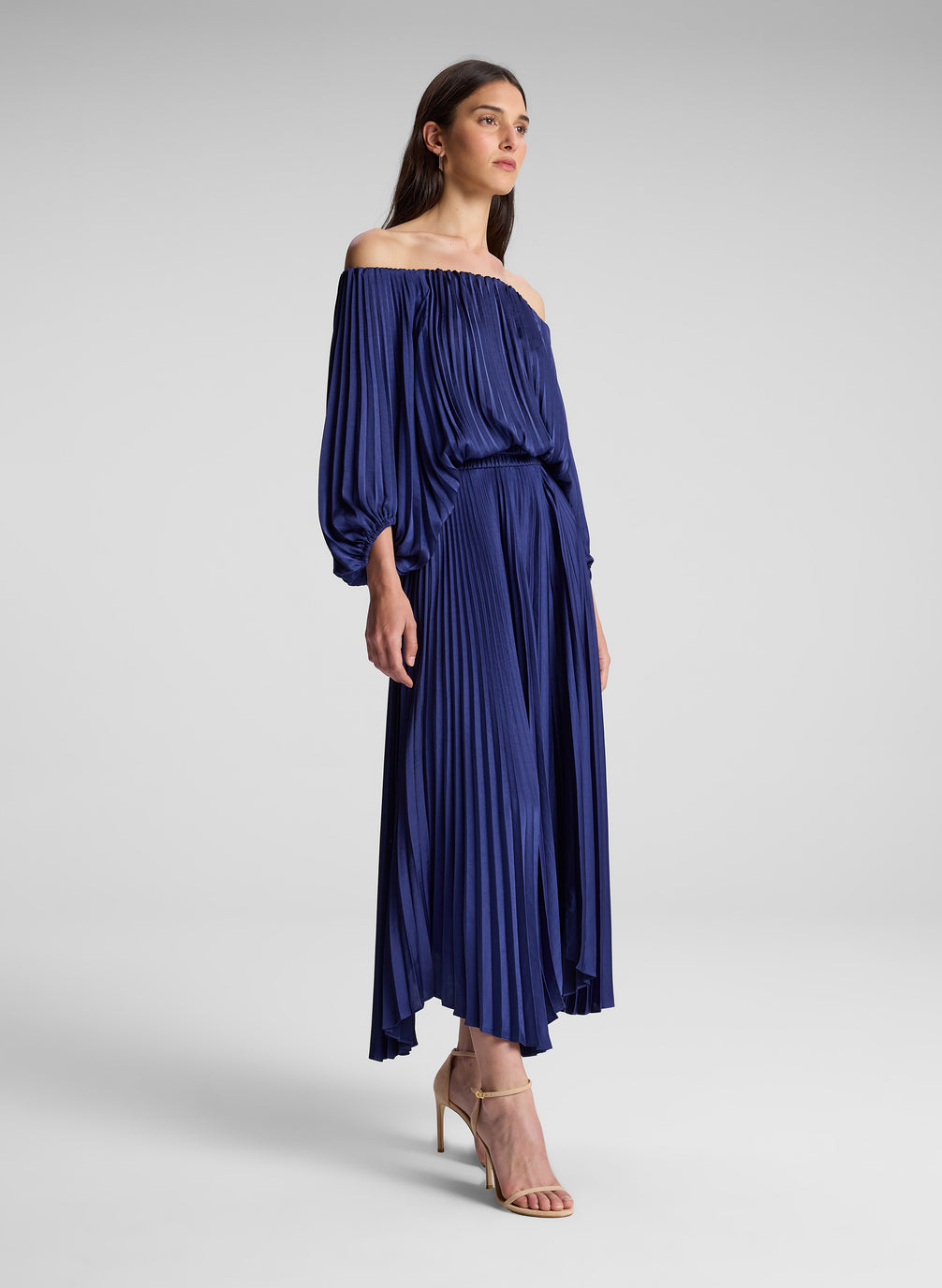 woman wearing navy blue off shoulder pleated dress