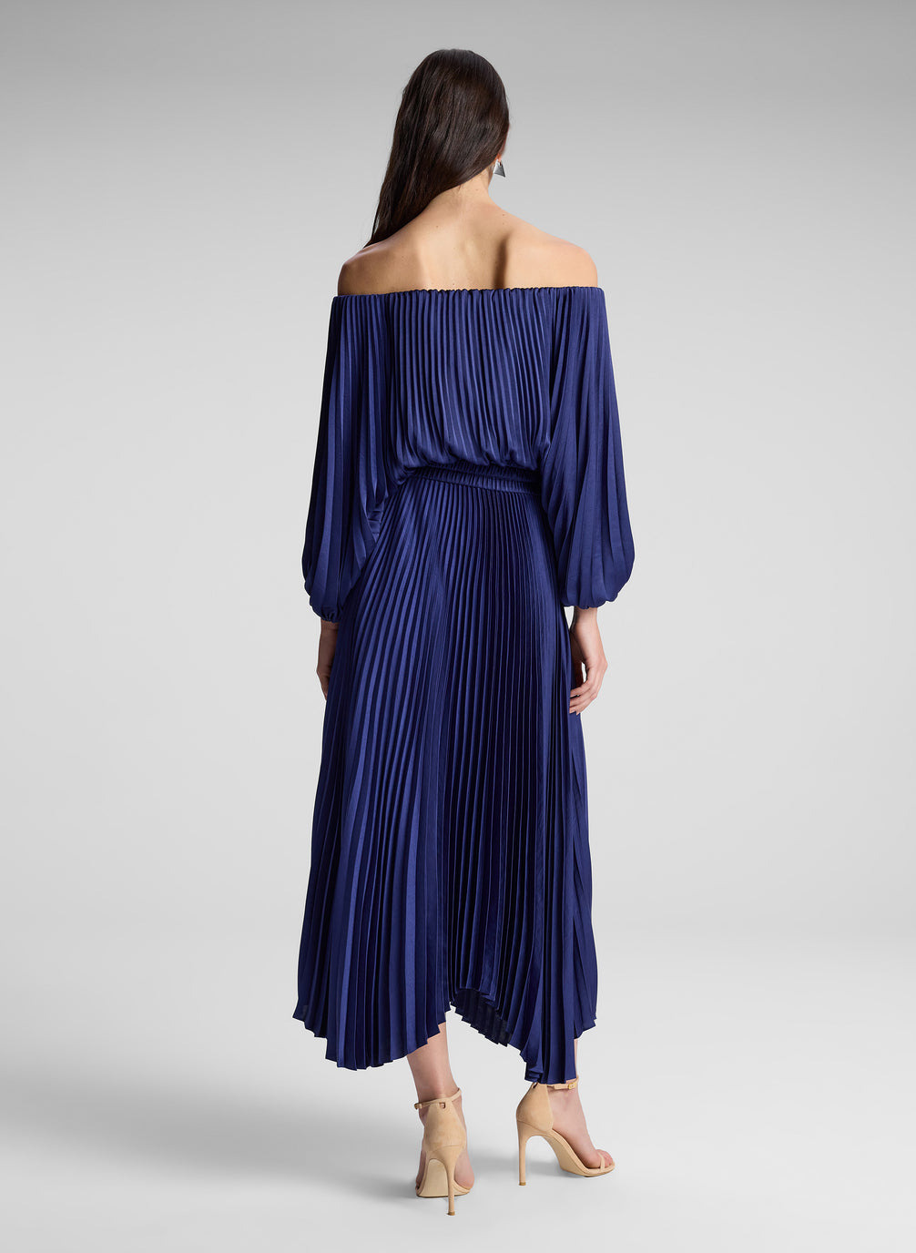 woman wearing navy blue off shoulder pleated dress