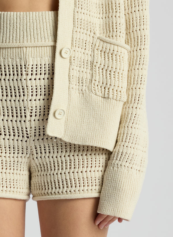 detail view of woman wearing knit coverups set