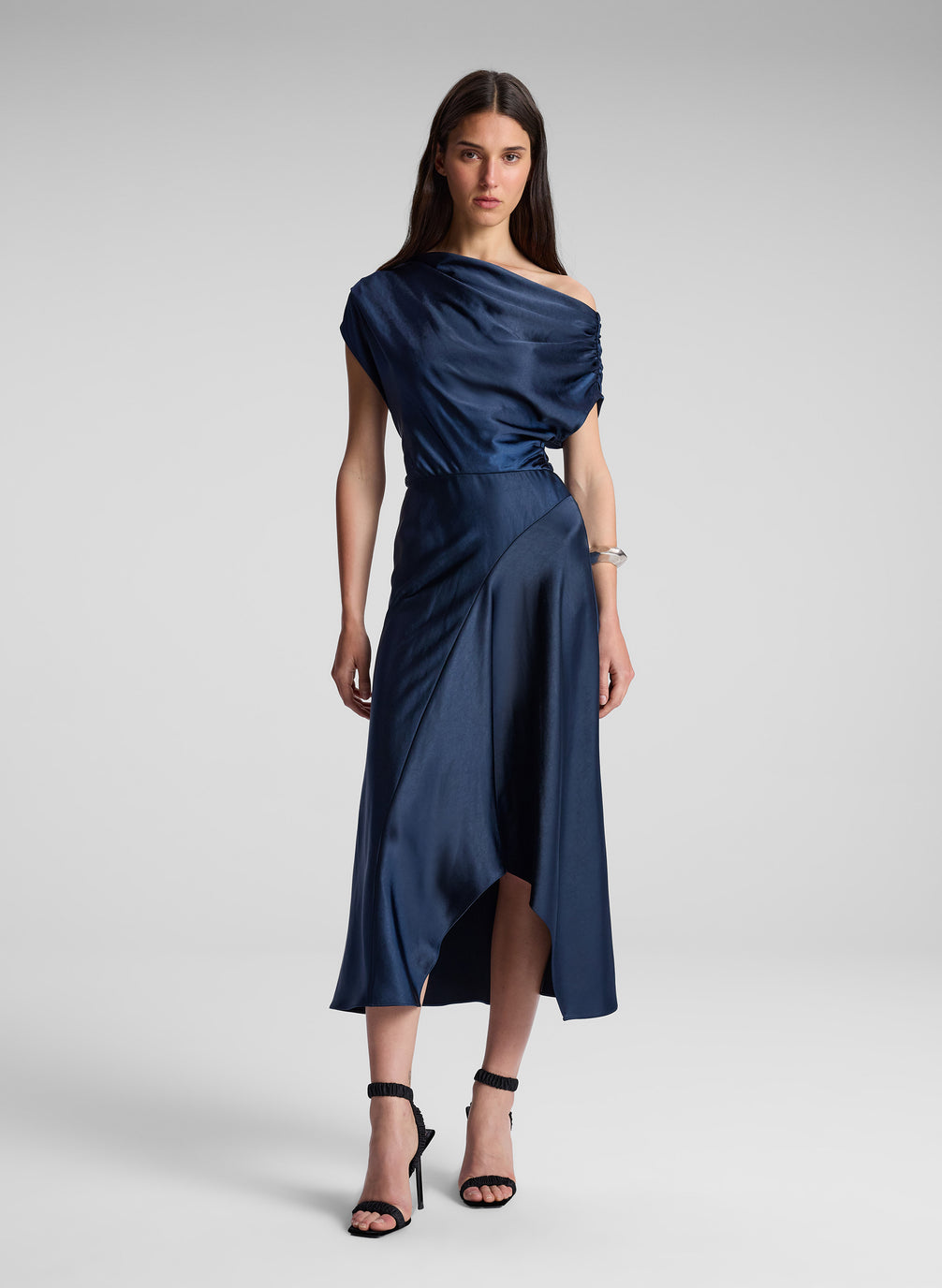 woman wearing navy blue satin midi dress