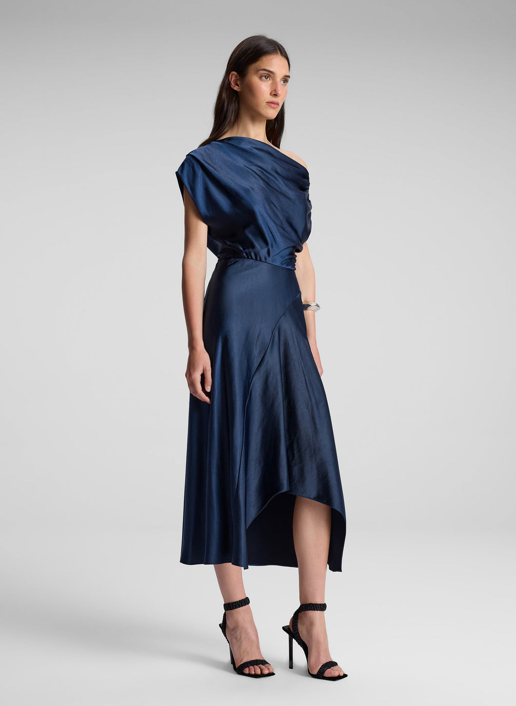 woman wearing navy blue satin midi dress