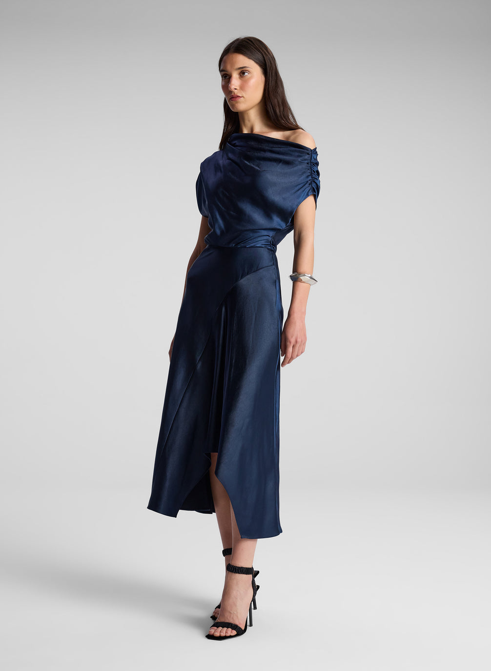 woman wearing navy blue satin midi dress