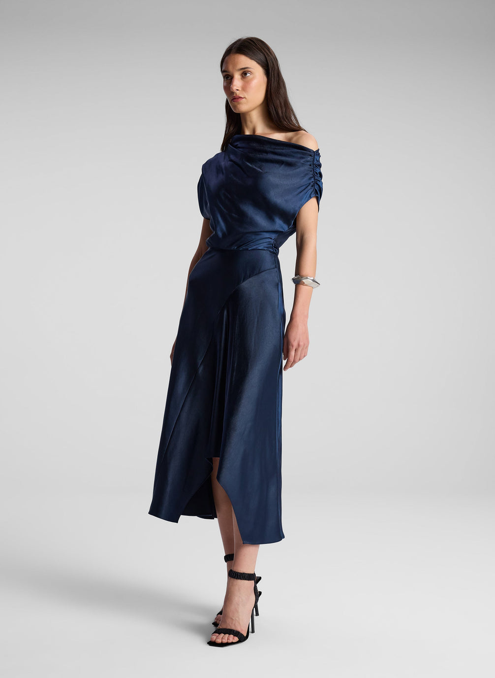 woman wearing navy blue satin midi dress