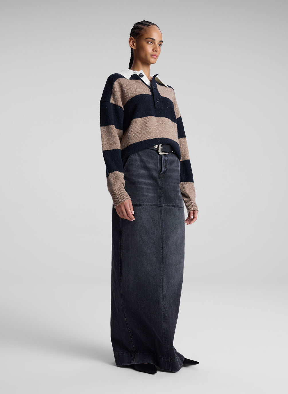 woman wearing striped collared sweater and black denim maxi skirt