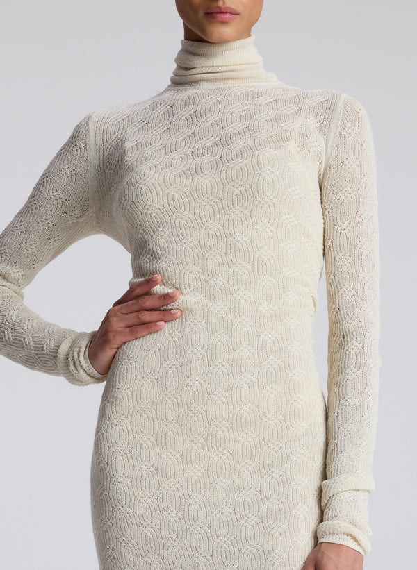 woman wearing cream alpaca sweater dress