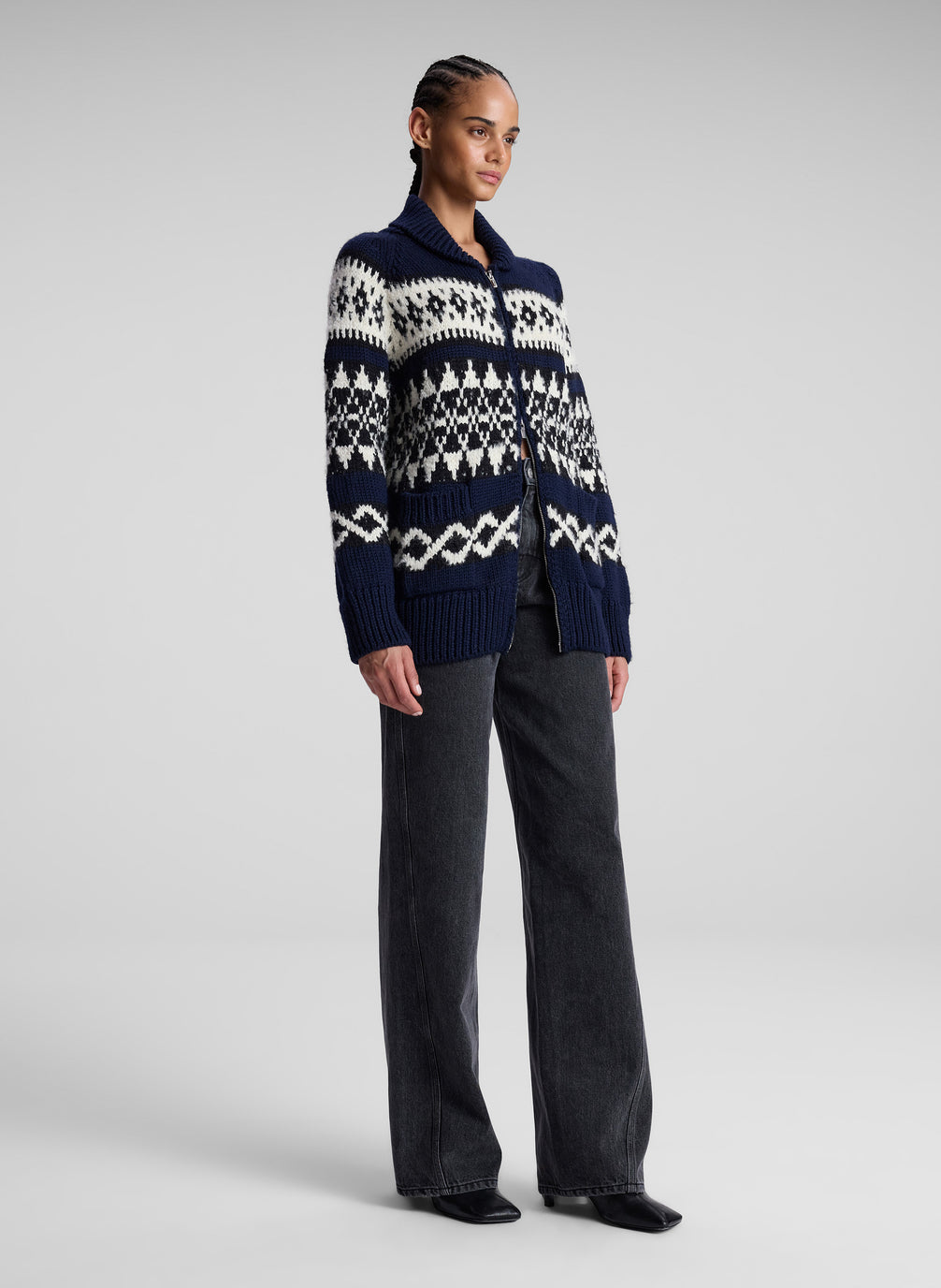 woman in navy fairisle cardigan and black denim