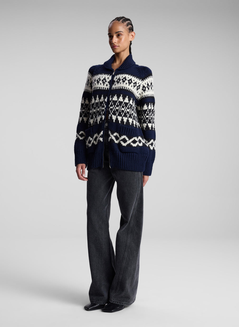 woman in navy fairisle cardigan and black denim