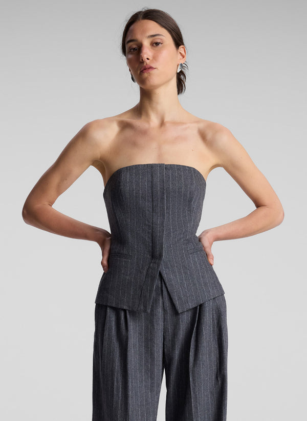 woman wearing grey pinstripe strapless top and matching pants