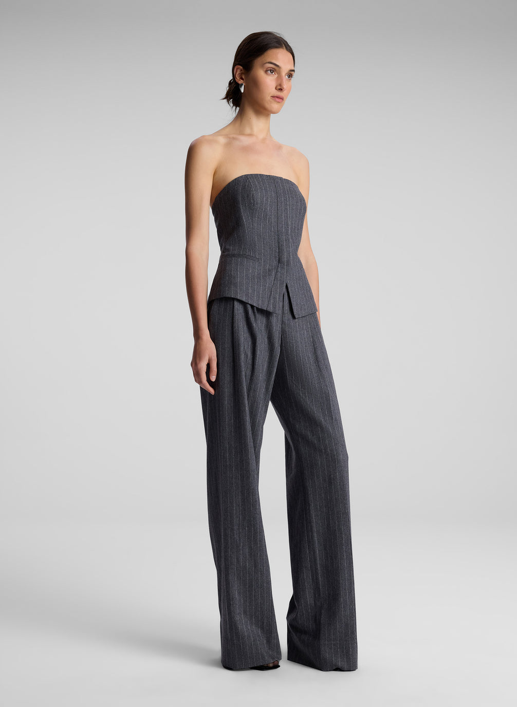 woman wearing grey pinstripe strapless top and matching pants