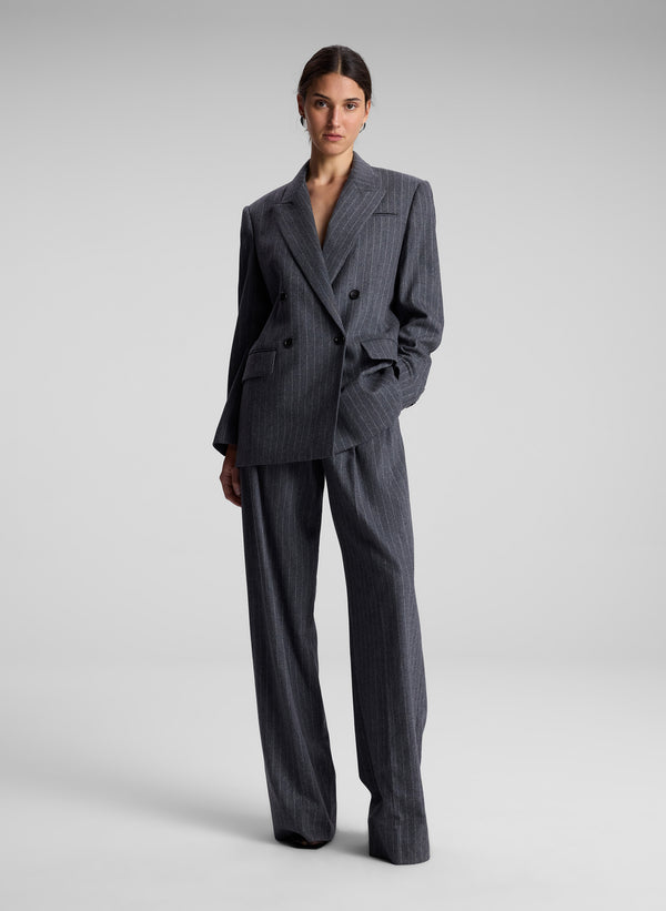 woman wearing oversized grey pinstripe suit