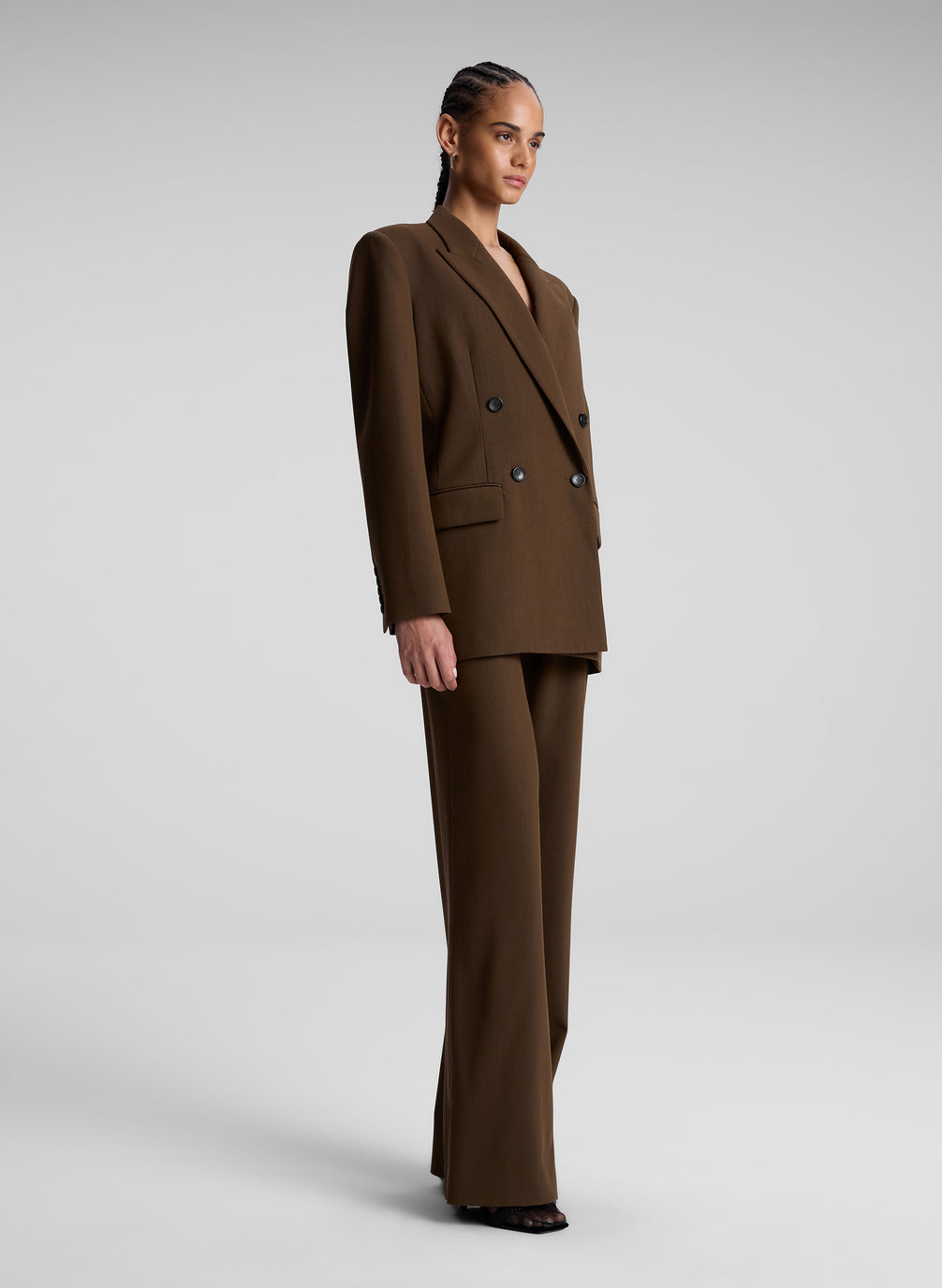 woman wearing brown oversized suit