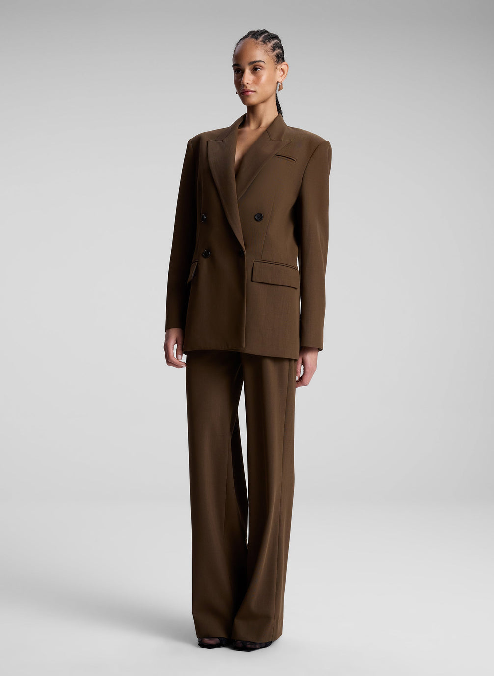 woman wearing brown oversized suit