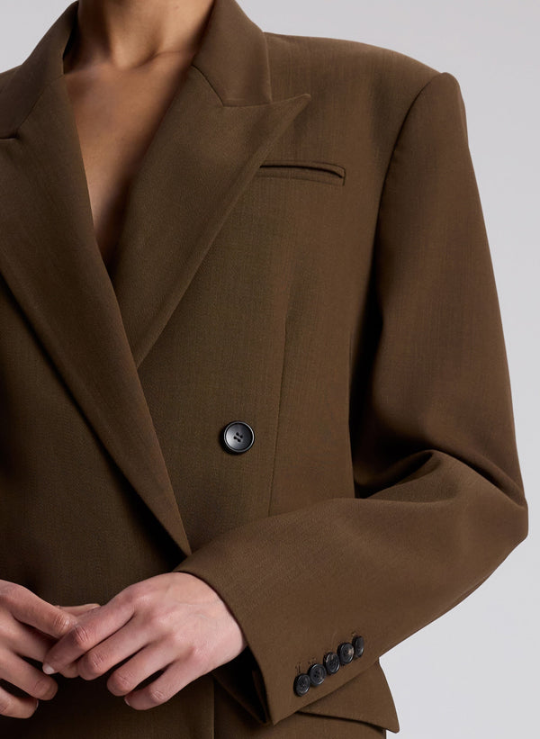 woman wearing brown oversized suit