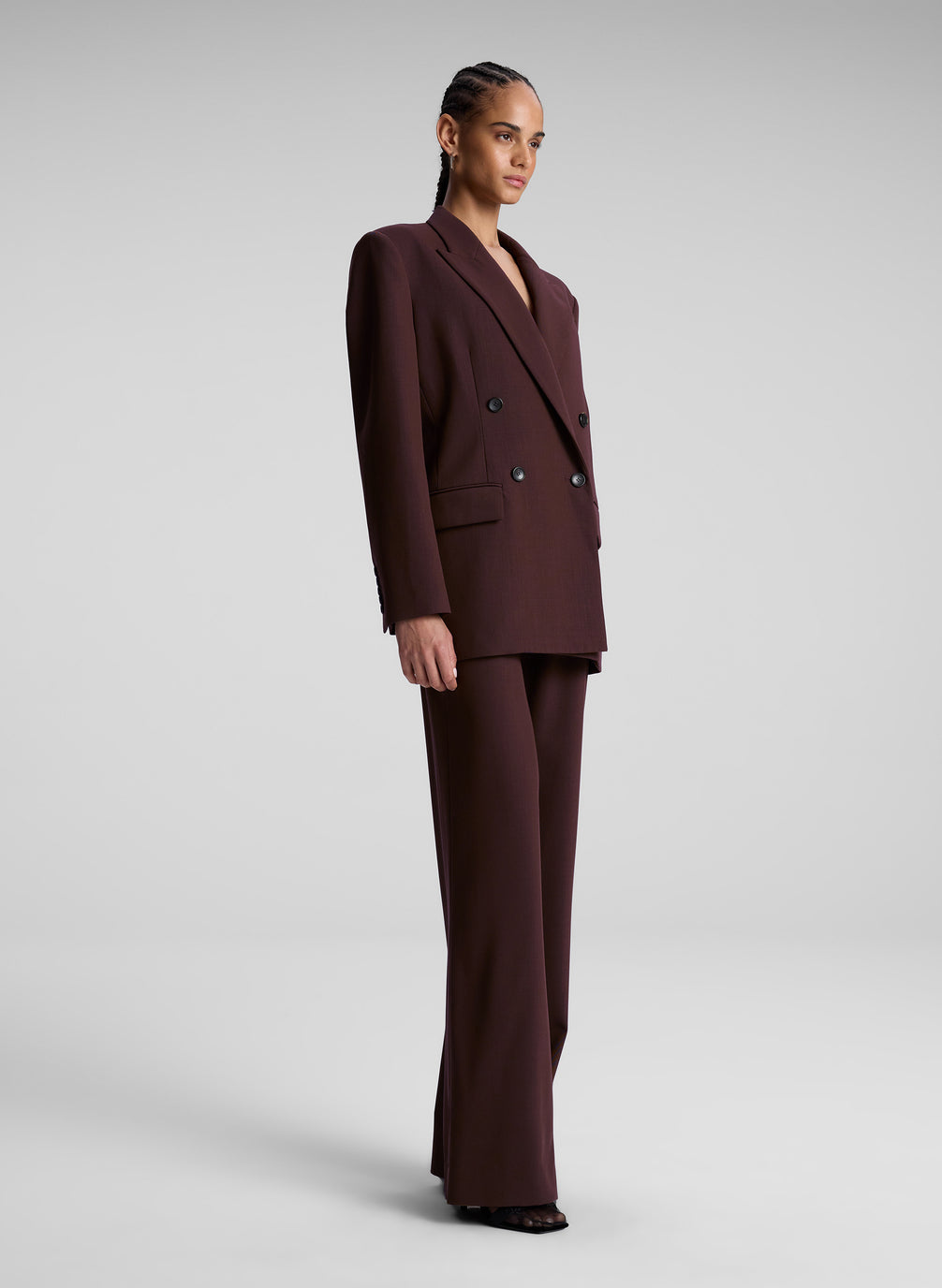 woman wearing brown suit