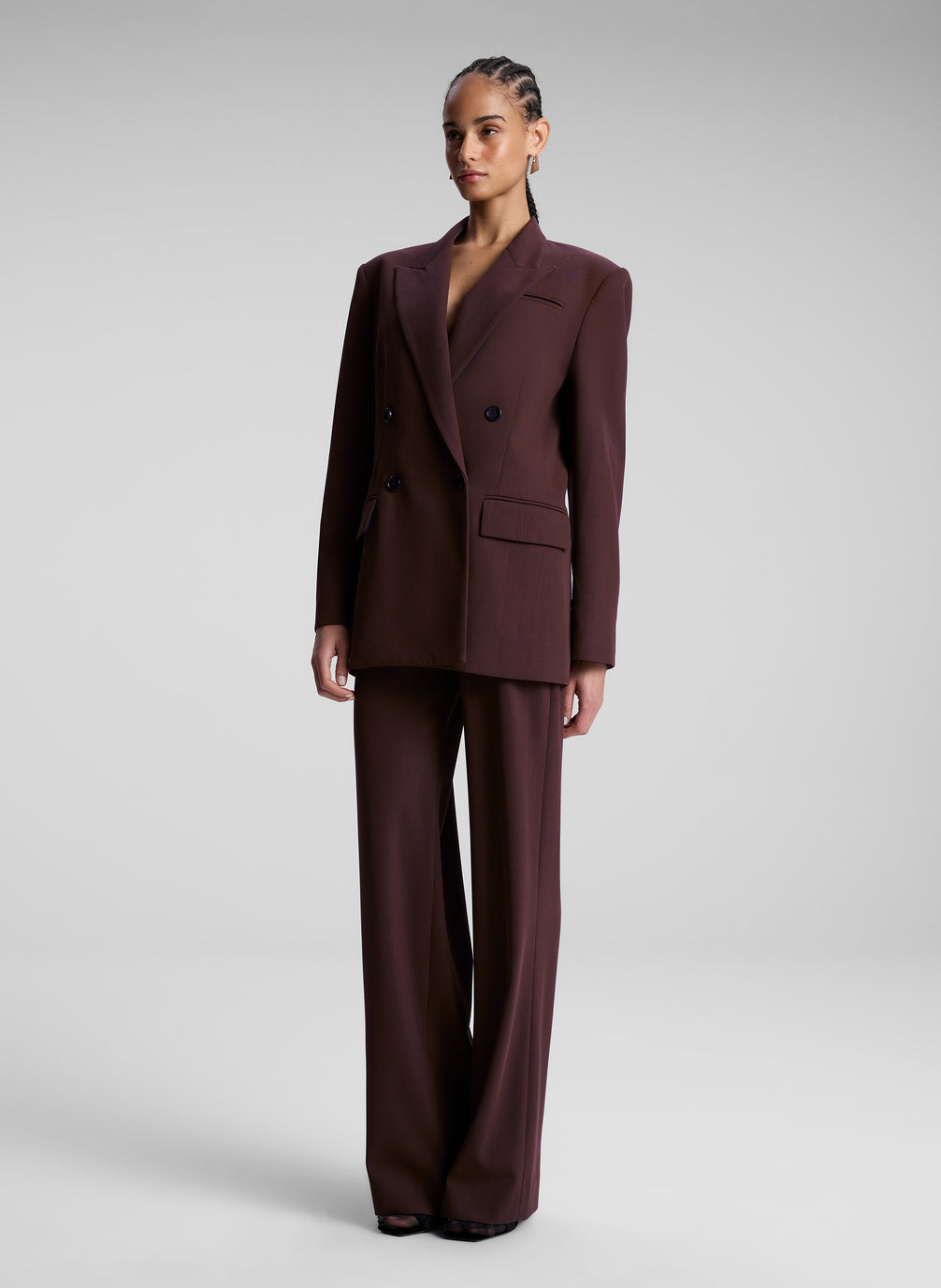 woman wearing brown suit