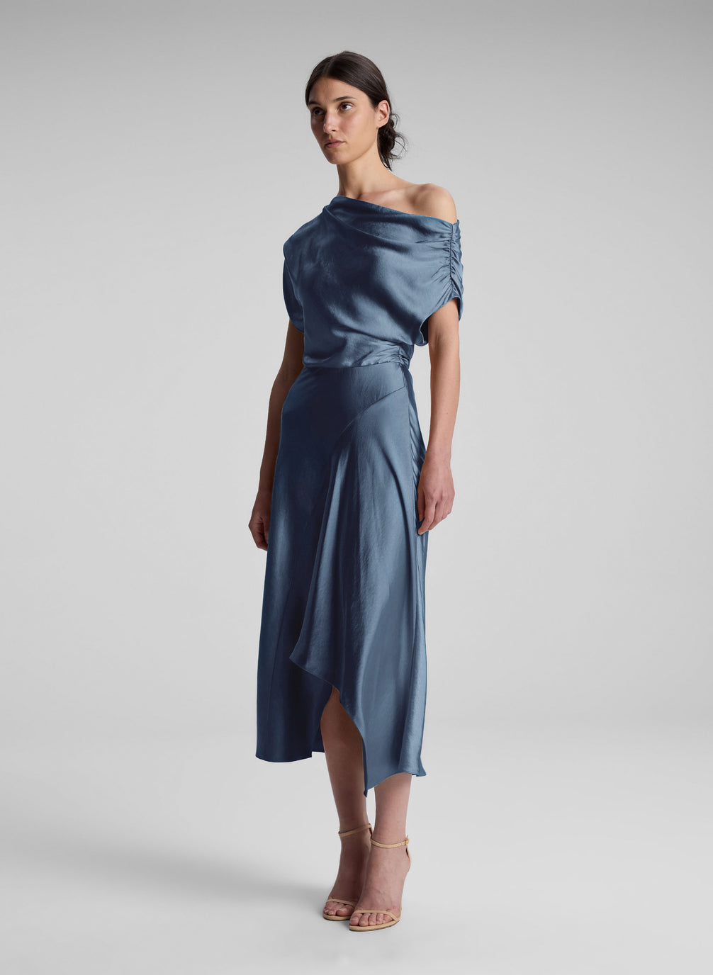 woman wearing blue satin midi dress