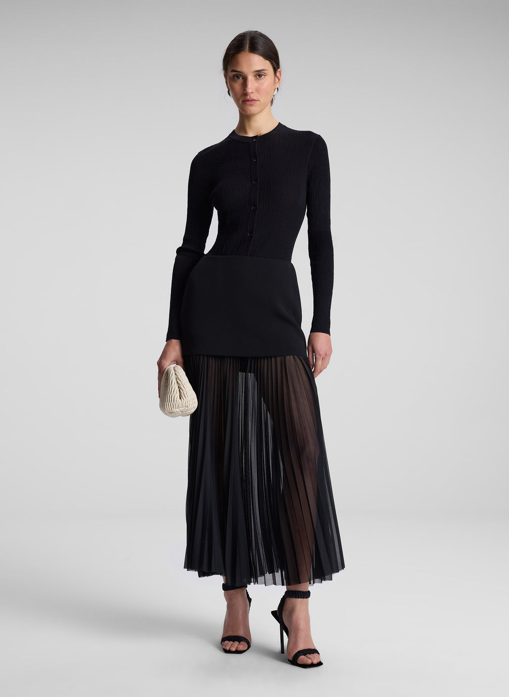 woman wearing black long sleeve tee and black maxi skirt