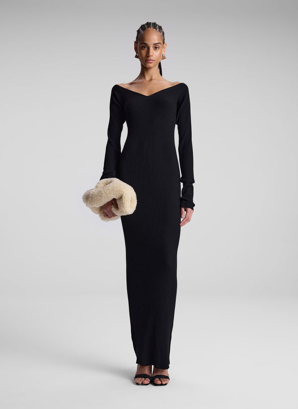 woman wearing black long sleeve maxi dress