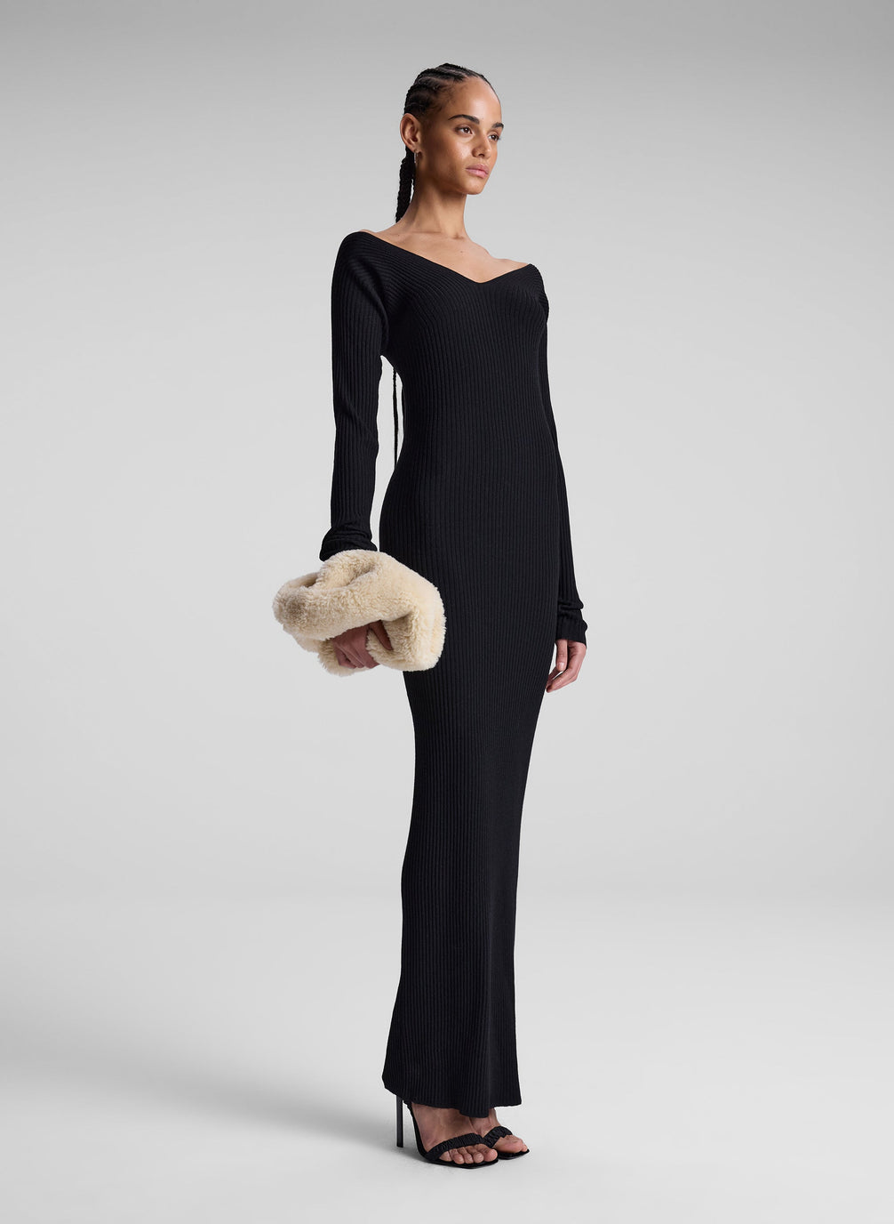 woman wearing black long sleeve maxi dress