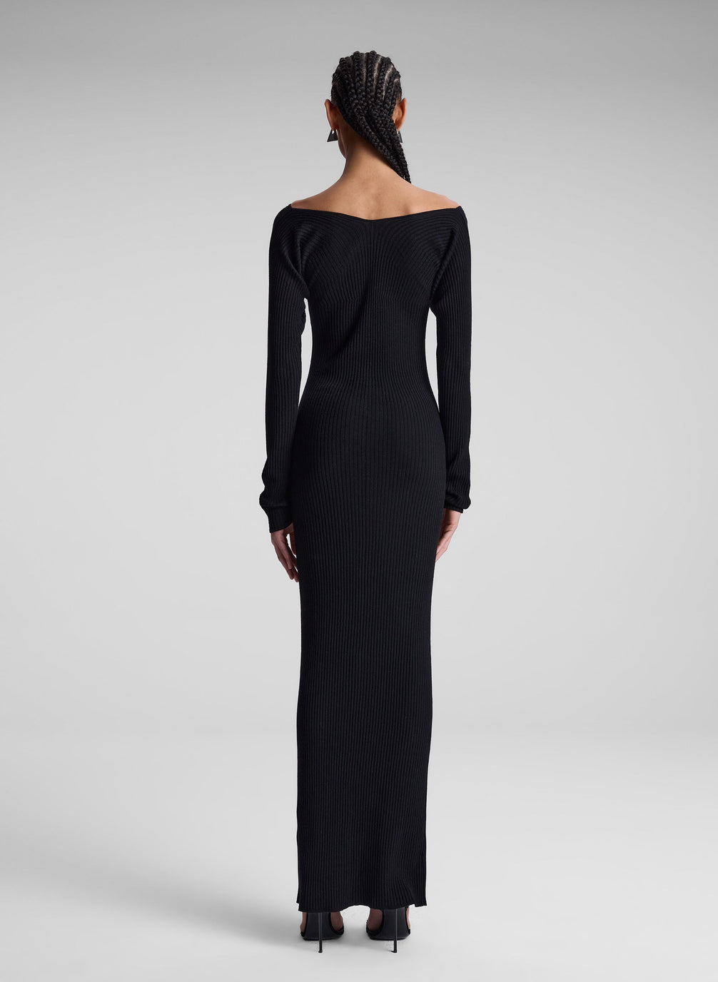 woman wearing black long sleeve maxi dress