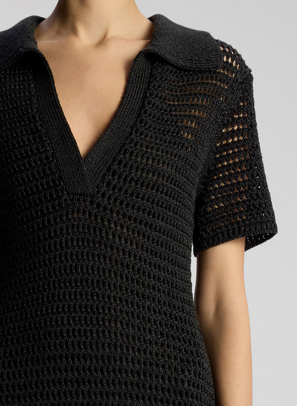 detail view of woman wearing black crochet cover up maxi dress