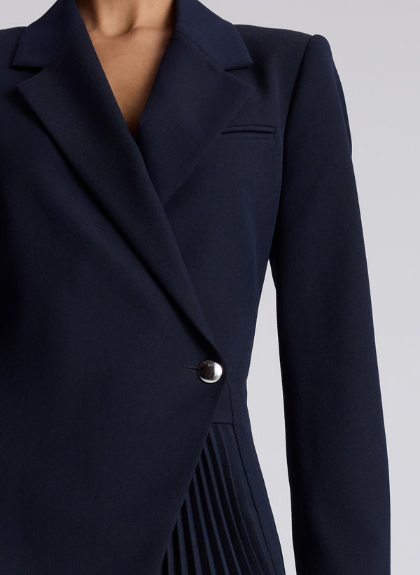 woman wearing navy blazer dress