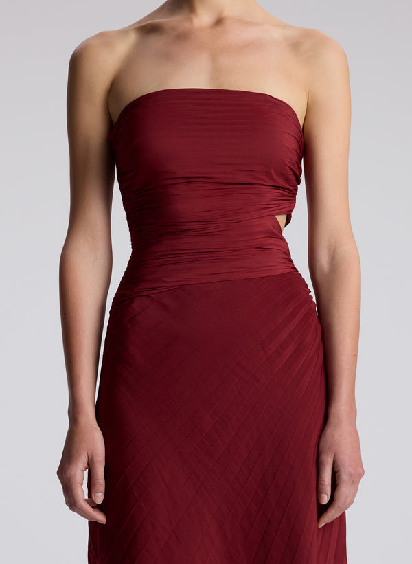 detail view of woman wearing red strapless midi dress