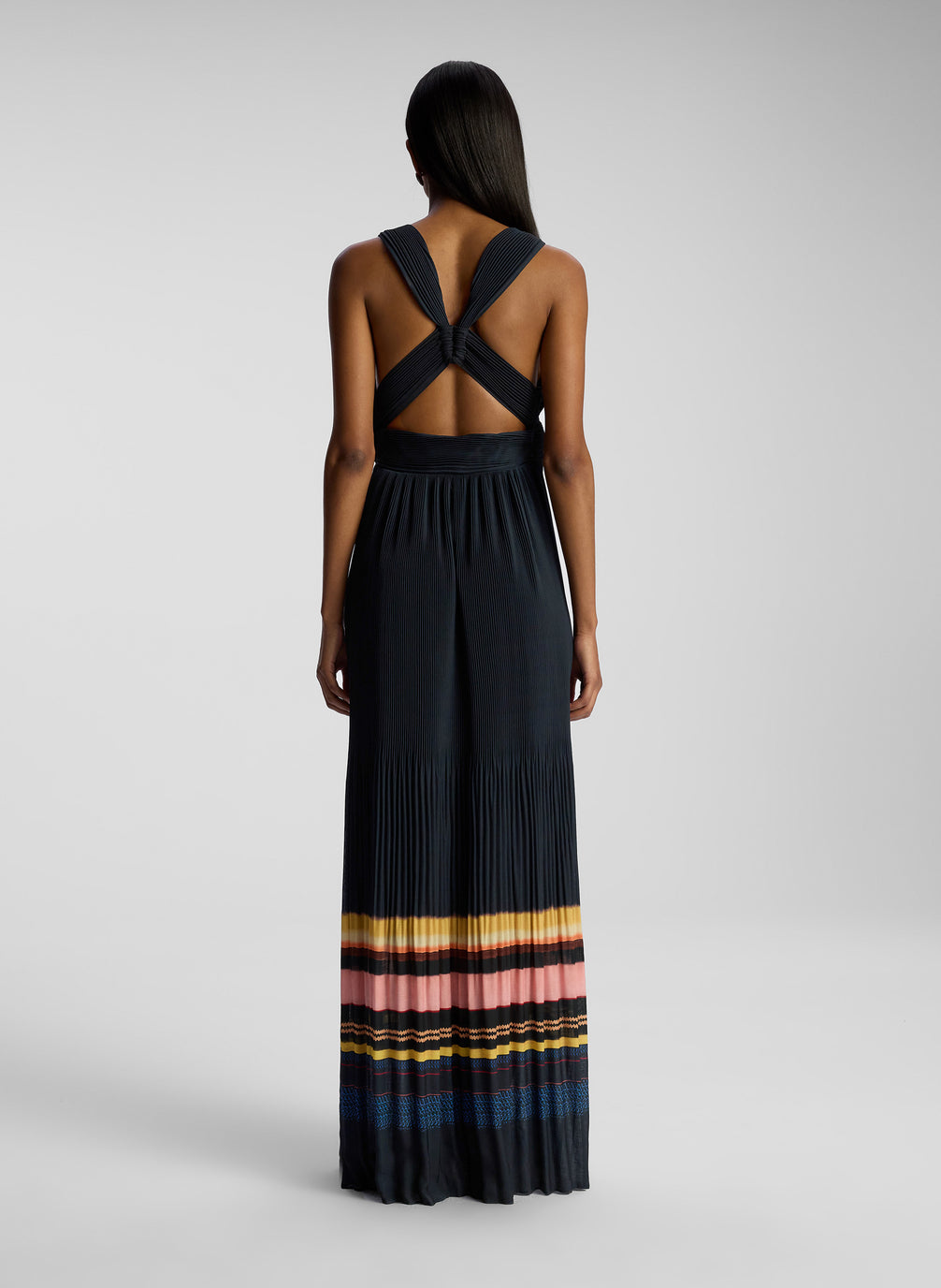 back view of woman wearing navy blue striped maxi dress