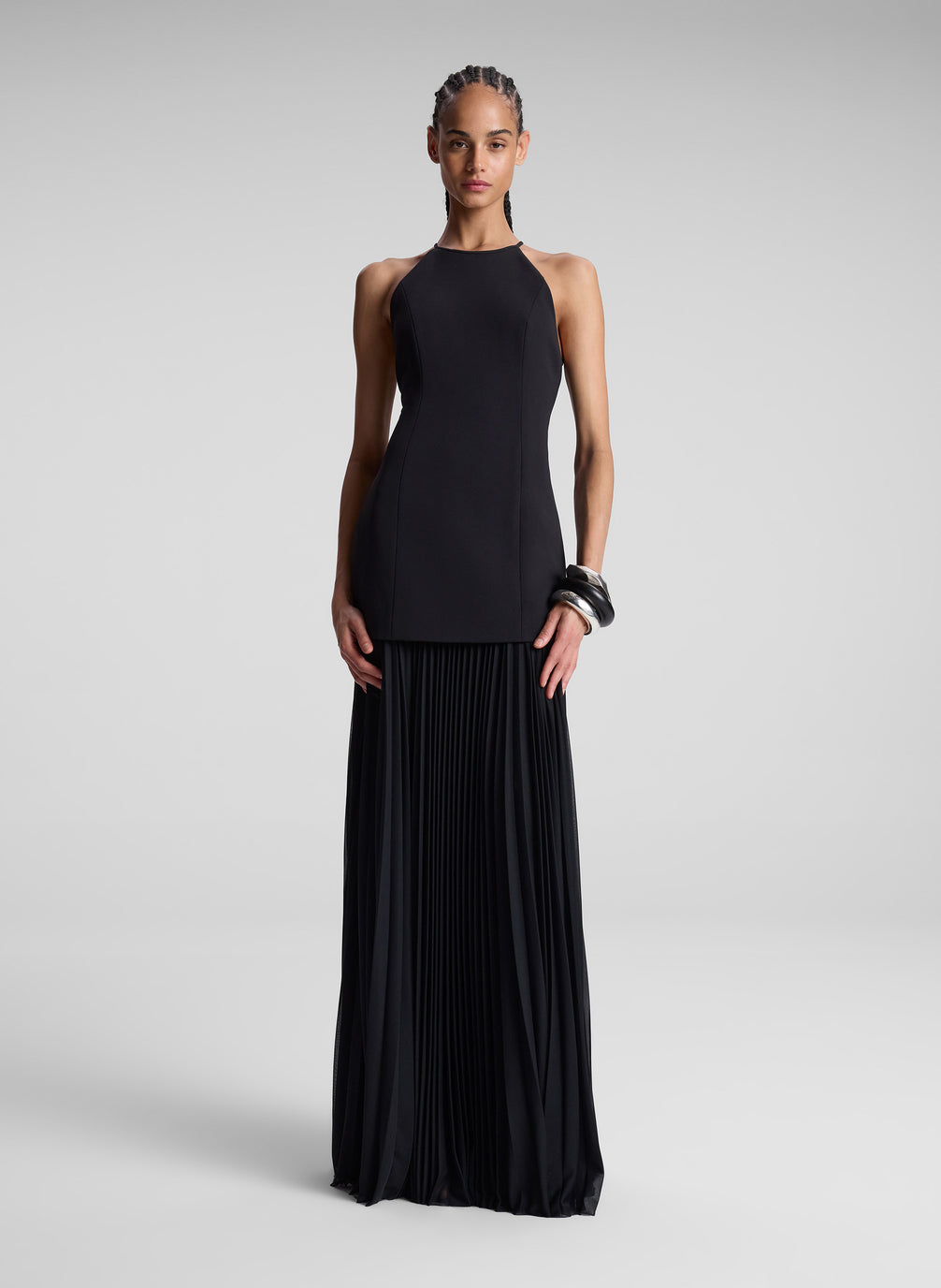 woman wearing black sleeveless maxi dress