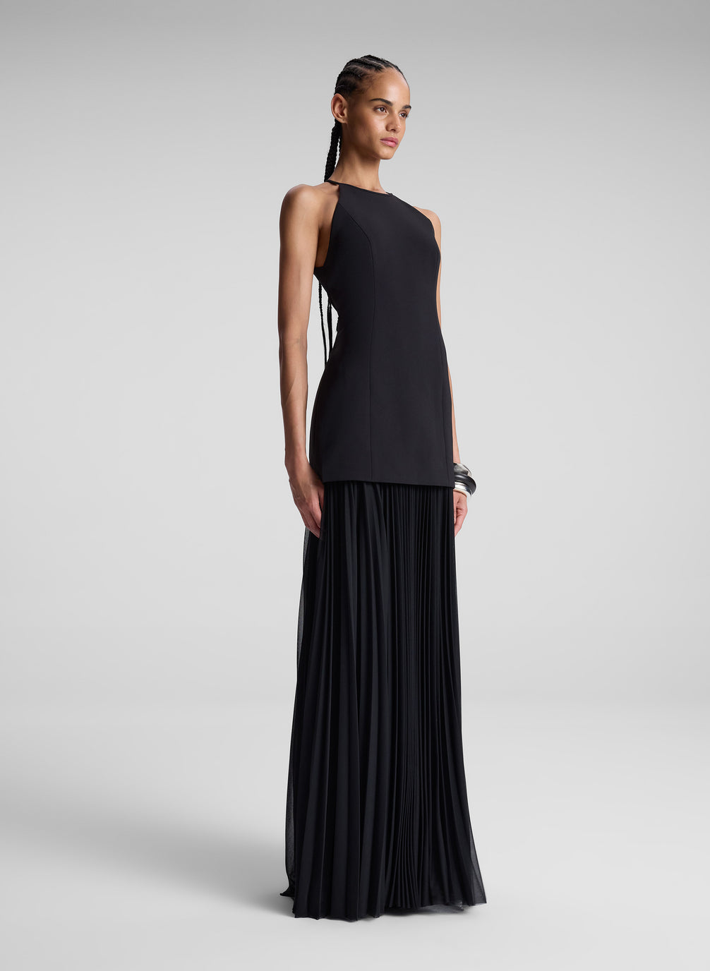 woman wearing black sleeveless maxi dress