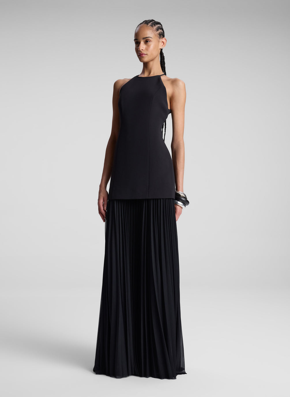 woman wearing black sleeveless maxi dress