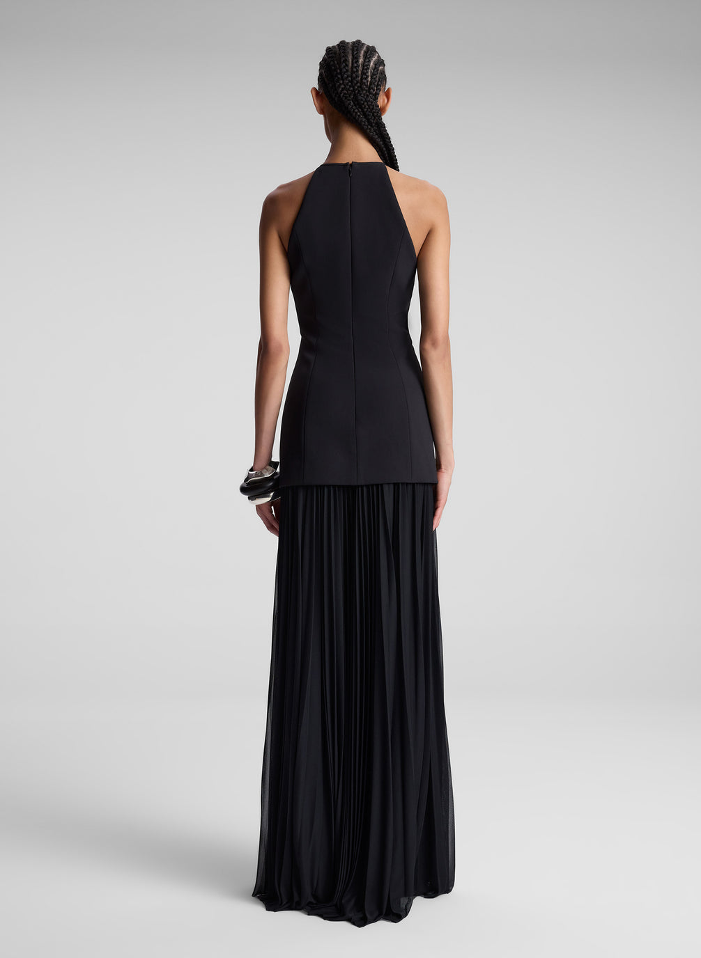 woman wearing black sleeveless maxi dress