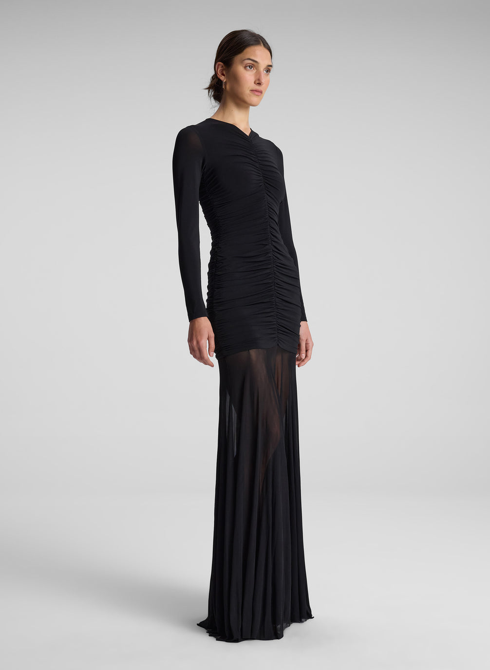 woman wearing black long sleeve maxi dress