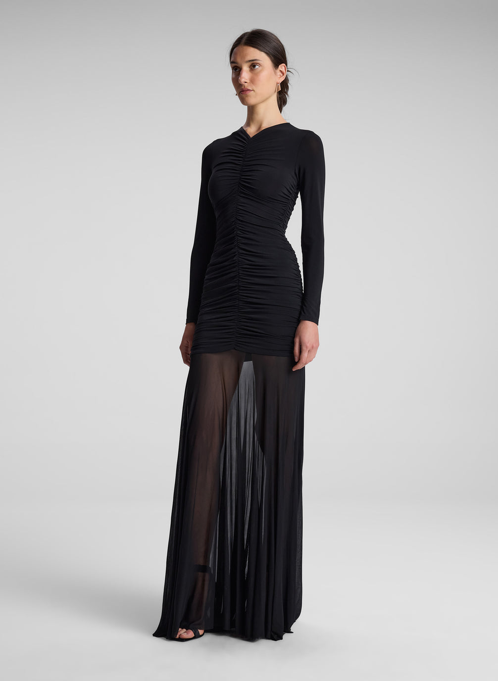 woman wearing black long sleeve maxi dress