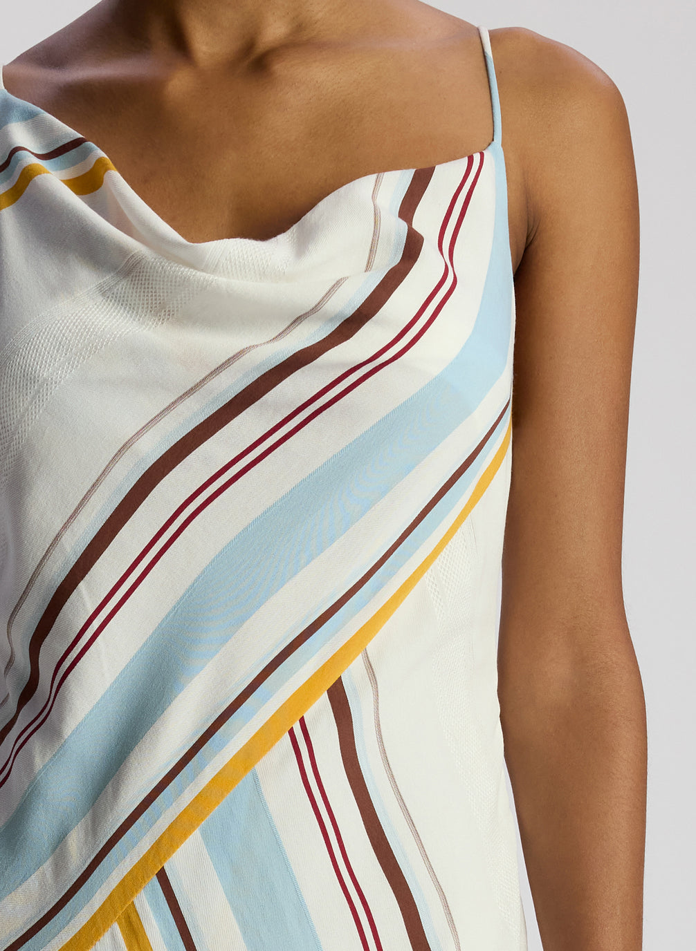 detail view of woman wearing multi color striped midi dress