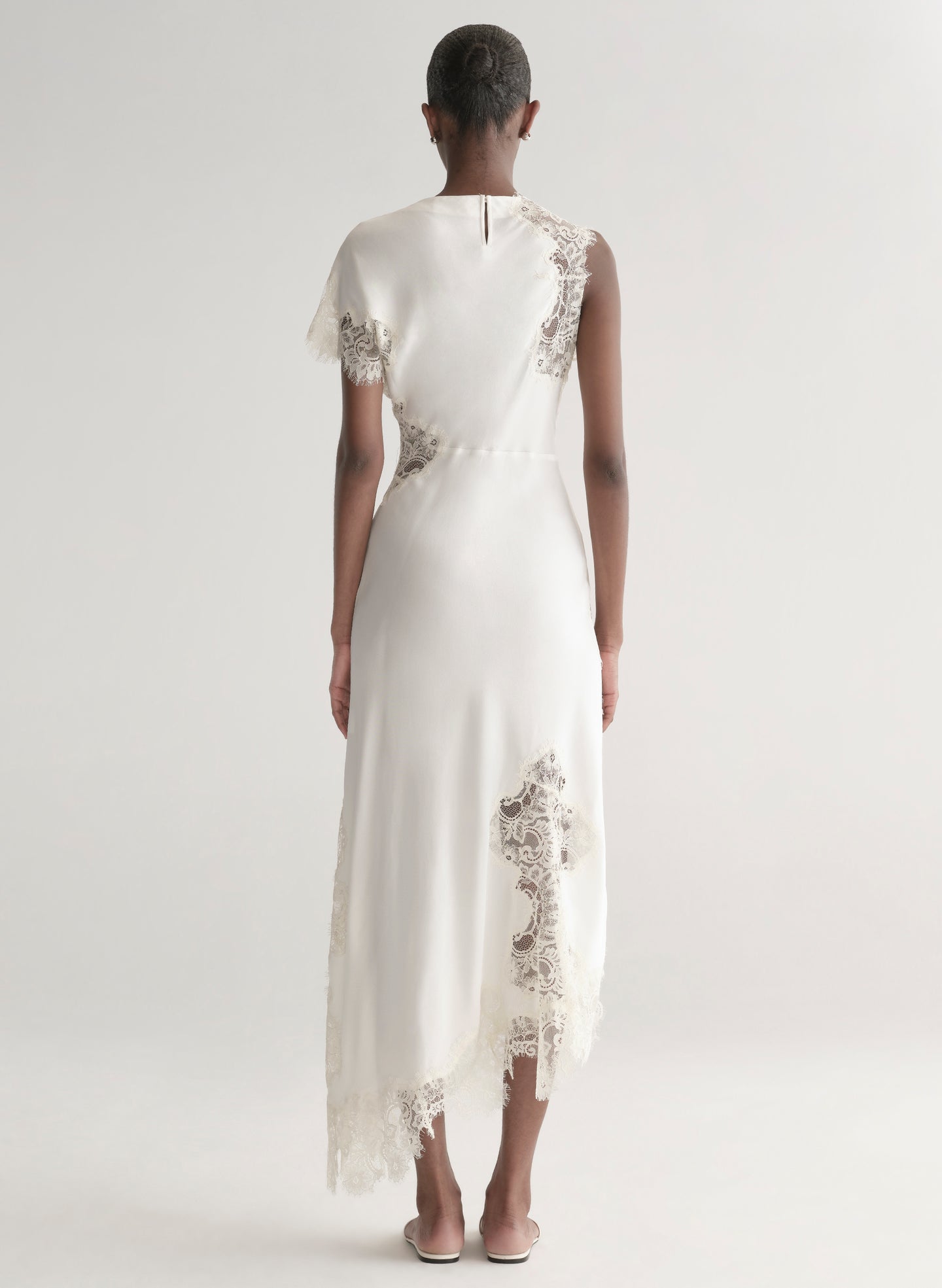 woman wearing white satin and lace dress